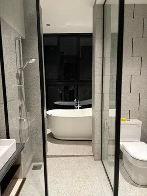 a bathroom with a bath tub and a toilet at Scarletz Suites KLCC Kuala Lumpur by OKIDOKI Homes in Kuala Lumpur