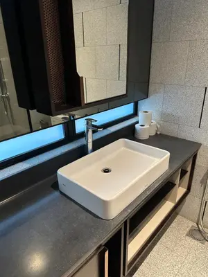 a white sink in a bathroom with a mirror at Scarletz Suites KLCC Kuala Lumpur by OKIDOKI Homes in Kuala Lumpur