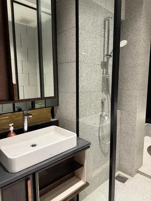 a bathroom with a sink and a shower at Scarletz Suites KLCC Kuala Lumpur by OKIDOKI Homes in Kuala Lumpur
