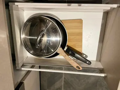 a pan and a knife inside of a oven at Scarletz Suites KLCC Kuala Lumpur by OKIDOKI Homes in Kuala Lumpur