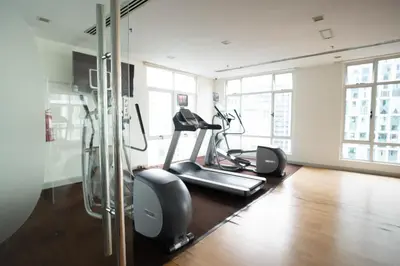 a gym with two exercise bikes in a room at 7 PAX, 1BR, 3mins to KLCC (3A3A) in Kuala Lumpur