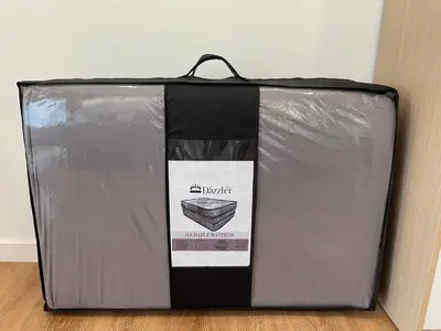 a black and silver box sitting on the floor at Quill Residence Premium Cozy Suite By Ares Homestay in Kuala Lumpur