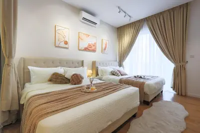 a hotel room with two beds and a window at Quill Residence Premium Cozy Suite By Ares Homestay in Kuala Lumpur