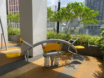 a yellow chair in an office with a view of a city at Quill Residence Premium Cozy Suite By Ares Homestay in Kuala Lumpur
