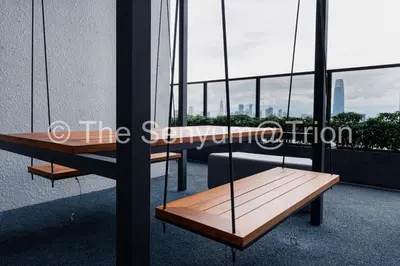 a wooden bench on the side of a building at TRION Studio 4 PAX Teneleven in Kuala Lumpur