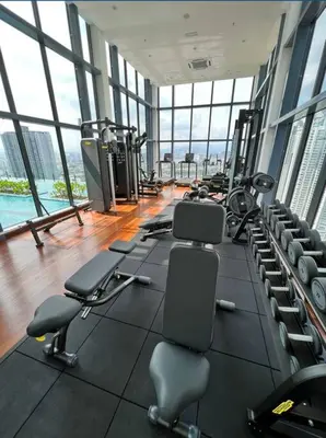 a gym with a lot of treadmills and machines at Novo KL, Astonishing Unique Executive Suite in Kuala Lumpur