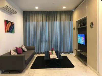 a living room with a couch and a tv at The Platinum KLCC By Classy in Kuala Lumpur
