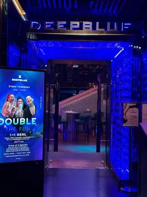 a blue lighted entrance to a stage with a movie sign at The Platinum KLCC By Classy in Kuala Lumpur