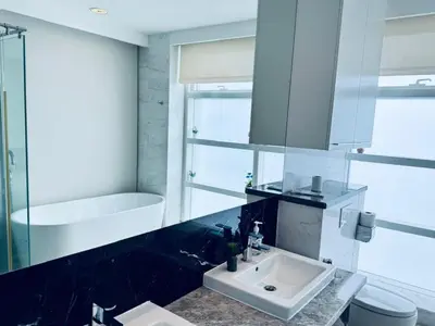 a bathroom with a sink and a bath tub at The Platinum KLCC By Classy in Kuala Lumpur