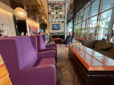 a lobby with purple furniture in a store at The Platinum KLCC By Classy in Kuala Lumpur