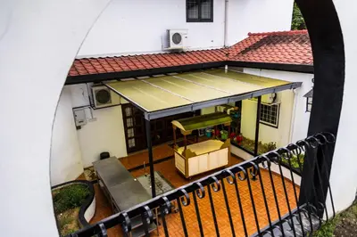 a view of a house from a balcony at Bangsar Villa for groups, event space and family fun in Kuala Lumpur
