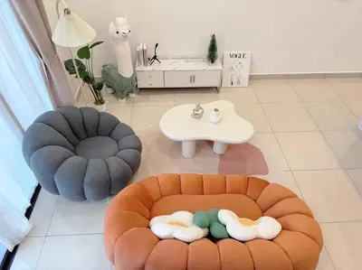 a living room with two ottomans and a table at NEW Scandinavian Modern TRX KL 2 Bedrooms in Kuala Lumpur