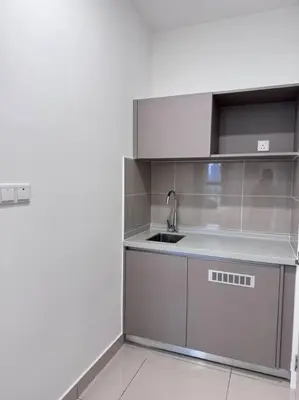 a kitchen with a sink and a counter top at NEW Scandinavian Modern TRX KL 2 Bedrooms in Kuala Lumpur