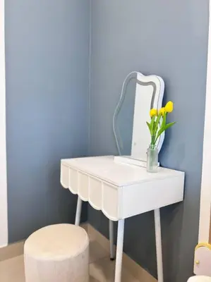 a white dressing table with a mirror and a stool at NEW Scandinavian Modern TRX KL 2 Bedrooms in Kuala Lumpur