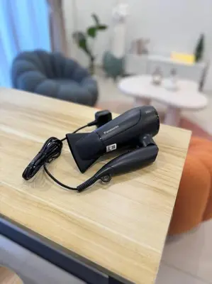 a black phone sitting on top of a table at NEW Scandinavian Modern TRX KL 2 Bedrooms in Kuala Lumpur