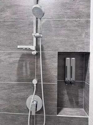 a shower with a shower head in a bathroom at NEW Scandinavian Modern TRX KL 2 Bedrooms in Kuala Lumpur