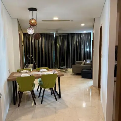a living room with a table and chairs and a couch at vortex klcc apartment by Dream NIGHT in Kuala Lumpur