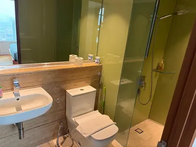a bathroom with a sink and a toilet and a shower at vortex klcc apartment by Dream NIGHT in Kuala Lumpur