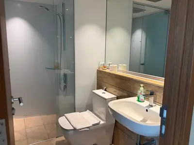 a bathroom with a toilet and a sink and a shower at vortex klcc apartment by Dream NIGHT in Kuala Lumpur