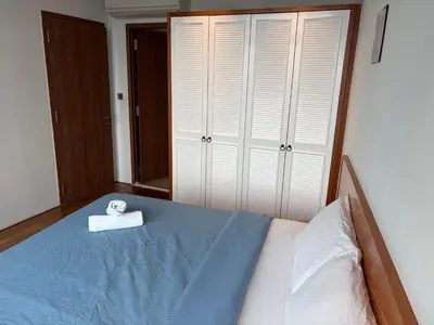 a bedroom with a bed with a towel on it at vortex klcc apartment by Dream NIGHT in Kuala Lumpur