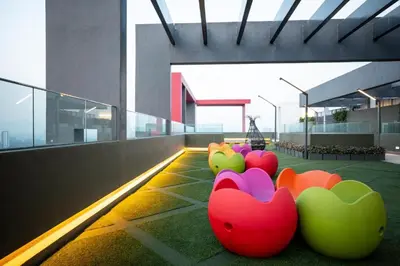 a row of colorful chairs on the floor of a building at Velocity Residence Suites By PSM in Kuala Lumpur