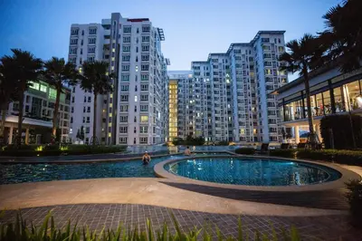 a large swimming pool in a city with tall buildings at Velocity Residence Suites By PSM in Kuala Lumpur