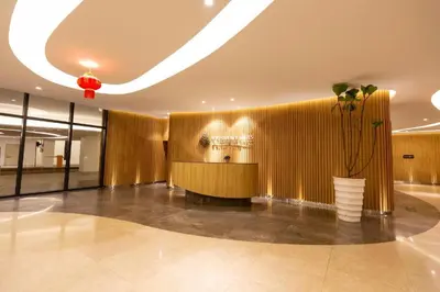 a lobby with a vase with a plant in it at Velocity Residence Suites By PSM in Kuala Lumpur