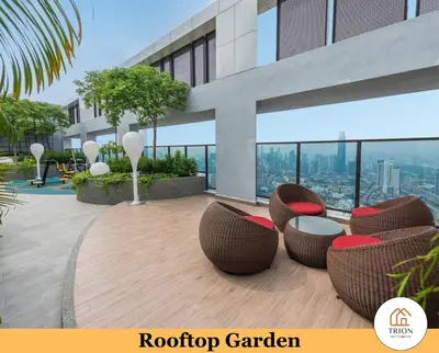 a rooftop garden with chairs and tables on a building at Trion Kuala Lumpur Near Sunway Velocity KLCC TRX Bukit Bintang in Kuala Lumpur
