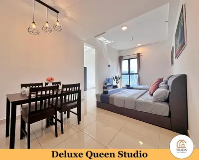 a bedroom with a bed and a table and a dining room at Trion Kuala Lumpur Near Sunway Velocity KLCC TRX Bukit Bintang in Kuala Lumpur