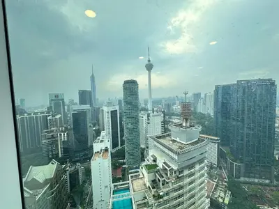 a view of a large city with skyscrapers at Sky Suites KL City Center in Kuala Lumpur