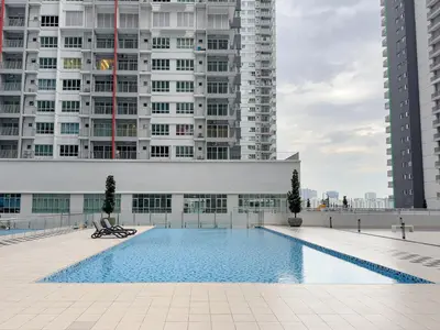 a swimming pool in front of a building with tall buildings at Instaworthy 3B3B - 6 pax - F&B & Mart - Chan Sow Lin in Kuala Lumpur