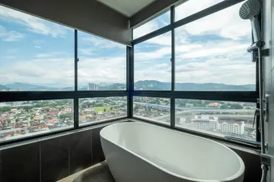 a bath tub in a room with a large window at Premium Classy 4Room@Astoria Ampang 12pax 6km KLCC in Kuala Lumpur