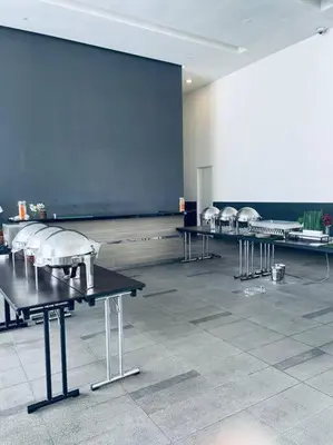 a row of tables in a large room at Premium Stay at Bukit Bintang City Centre by Premium Stay in Kuala Lumpur