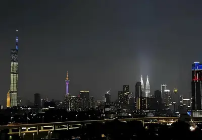 a view of a city skyline at night at Razak City Centre KL SkyView 45th in Kuala Lumpur