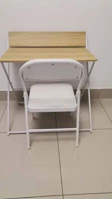 a desk with a wooden top with a stool under it at Razak City Centre KL SkyView 45th in Kuala Lumpur