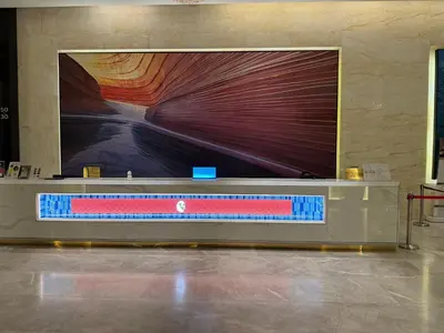a large screen on a wall in a room at The Platinum KLCC by Skyline in Kuala Lumpur