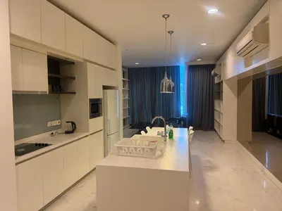 a kitchen with white cabinets and a white counter top at The Platinum KLCC by Skyline in Kuala Lumpur
