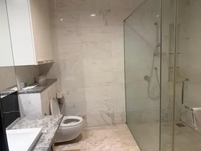 a bathroom with a shower and a toilet and a sink at The Platinum KLCC by Skyline in Kuala Lumpur