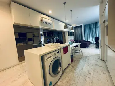a kitchen and living room with a washing machine at The Platinum KLCC by Skyline in Kuala Lumpur