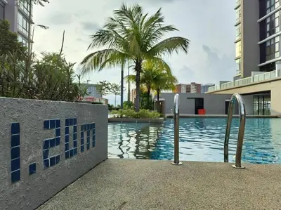 a swimming pool in the middle of a building at Premium Cozy Studio Near Mid Valley in Kuala Lumpur