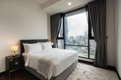 a hotel room with a bed and a large window at Opus Signatures ChinaTown 118 in Kuala Lumpur