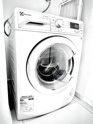 a white washing machine sitting in a room at Home Sweet Home at Robertson Bukit Bintang,trx,klcc,pavilion,lalaport in Kuala Lumpur