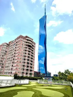 a tall building with a blue sculpture in front of it at Home Sweet Home at Robertson Bukit Bintang,trx,klcc,pavilion,lalaport in Kuala Lumpur