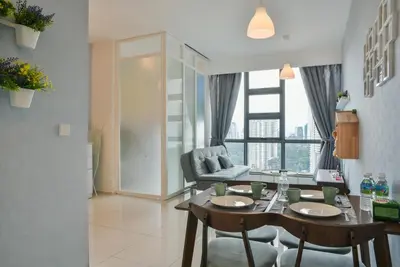 a living room with a table and chairs and a couch at Home Sweet Home at Robertson Bukit Bintang,trx,klcc,pavilion,lalaport in Kuala Lumpur