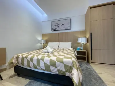 a bedroom with a large bed in a room at The Luxe & The Colony Infinitum by Romeo Bnb in Kuala Lumpur