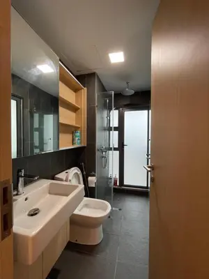 a bathroom with a sink and a toilet at The Luxe & The Colony Infinitum by Romeo Bnb in Kuala Lumpur