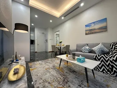 a living room with a couch and a table at Royce Residences by Romeo Bnb in Kuala Lumpur