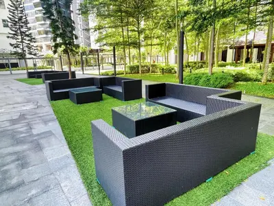 a seating area with black furniture in a park at D'Rapport Residences by Manhattan Group in Kuala Lumpur