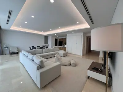 a living room with a white couch and a table at D'Rapport Residences by Manhattan Group in Kuala Lumpur