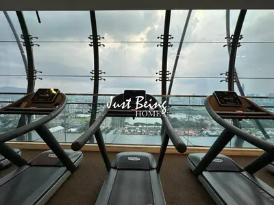 a gym with two treadmills in front of a window at Just Being Home 5pax 1BR/1BA 1Queen/1Single/1Sofa in Kuala Lumpur